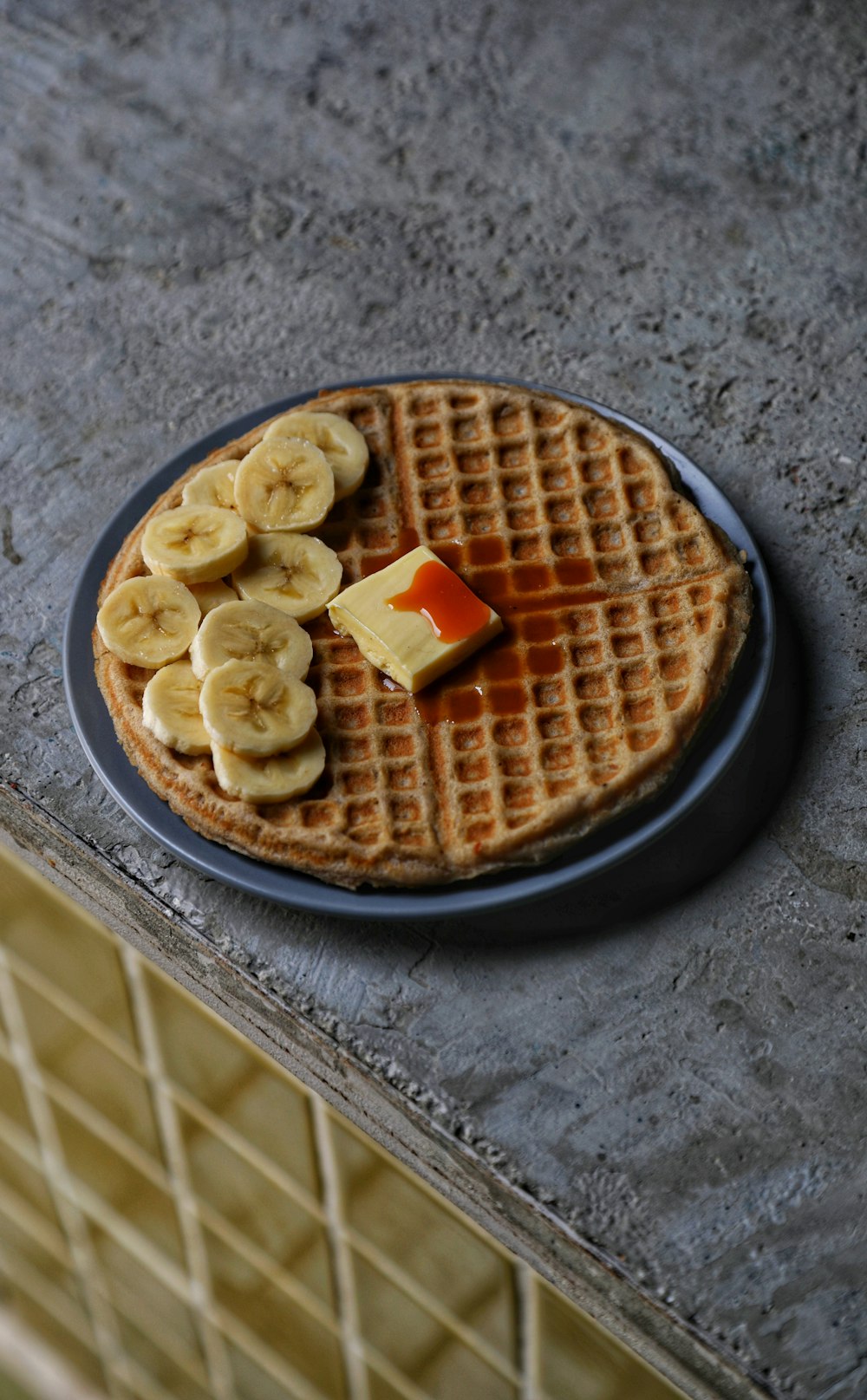 brown waffle on brown ceramic plate