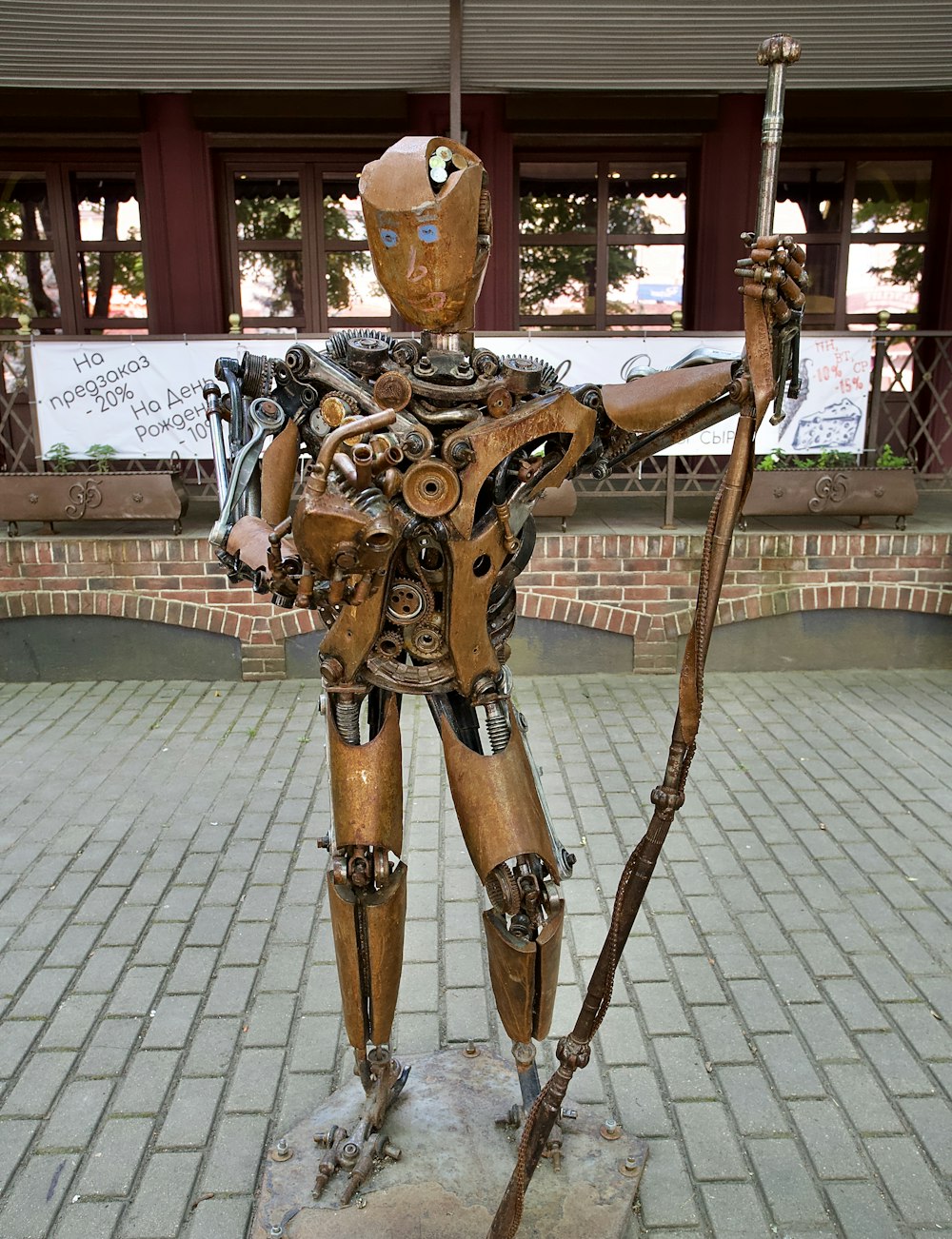 gold human statue on gray concrete floor