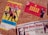 The image depicts three vintage concert tickets pinned to a corkboard. The first ticket features colorful graphics of a band called Spandau Ballet, with a predominantly yellow background. The second ticket is for a Duran Duran concert, marked by bold yellow text on a red background, with band member images in the corner. The third ticket, partially visible at the bottom, is for a Pet Shop Boys performance, showcasing an image of one of the members, along with text in red and black on a white background.