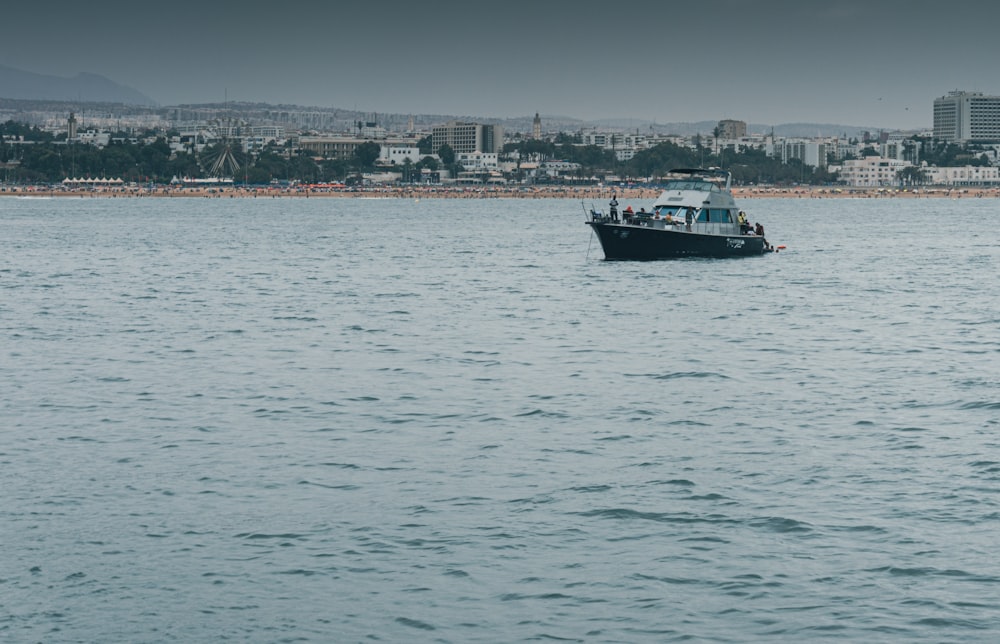 red and white boat on sea during daytime