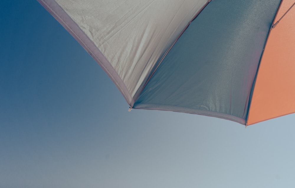 white umbrella under blue sky during daytime