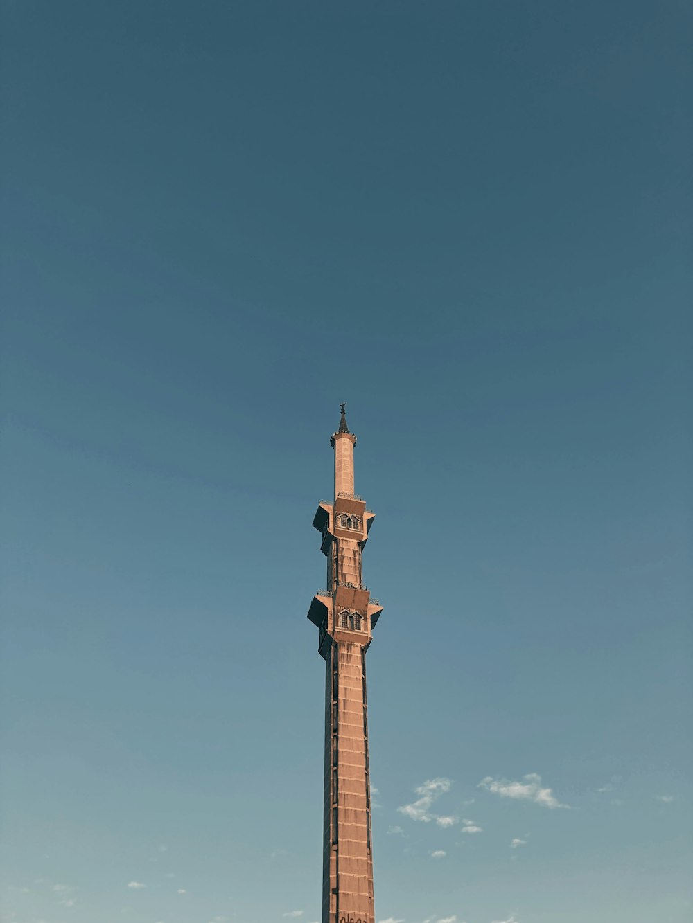 brown concrete tower under blue sky during daytime