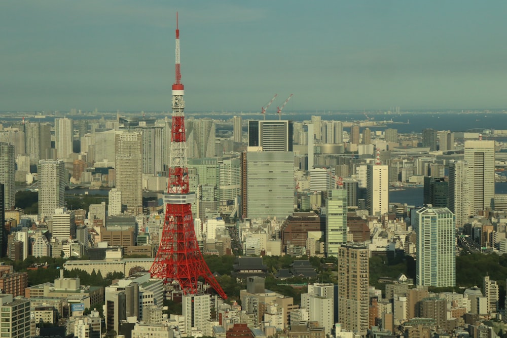 red and white tower in the city during daytime