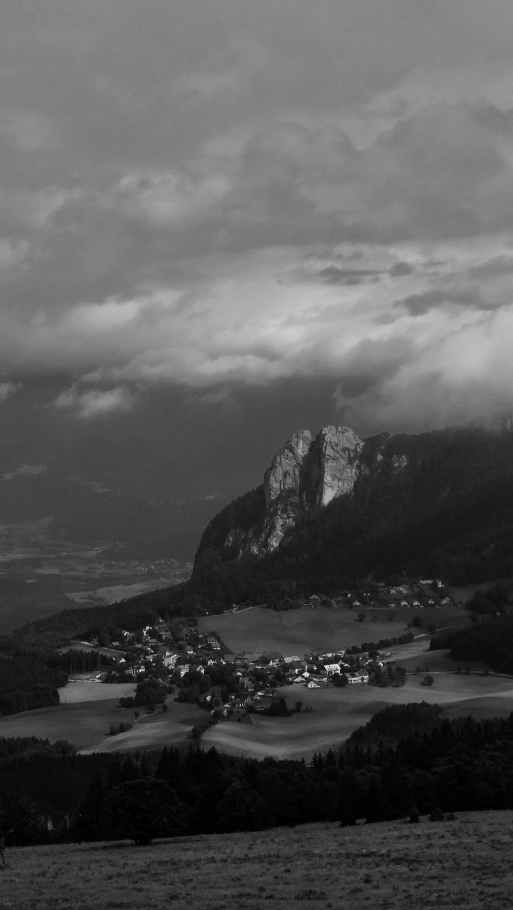 grayscale photo of mountains and river