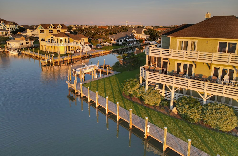 white and brown concrete building beside body of water during daytime