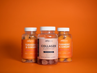 2 brown and white labeled bottles vitamins