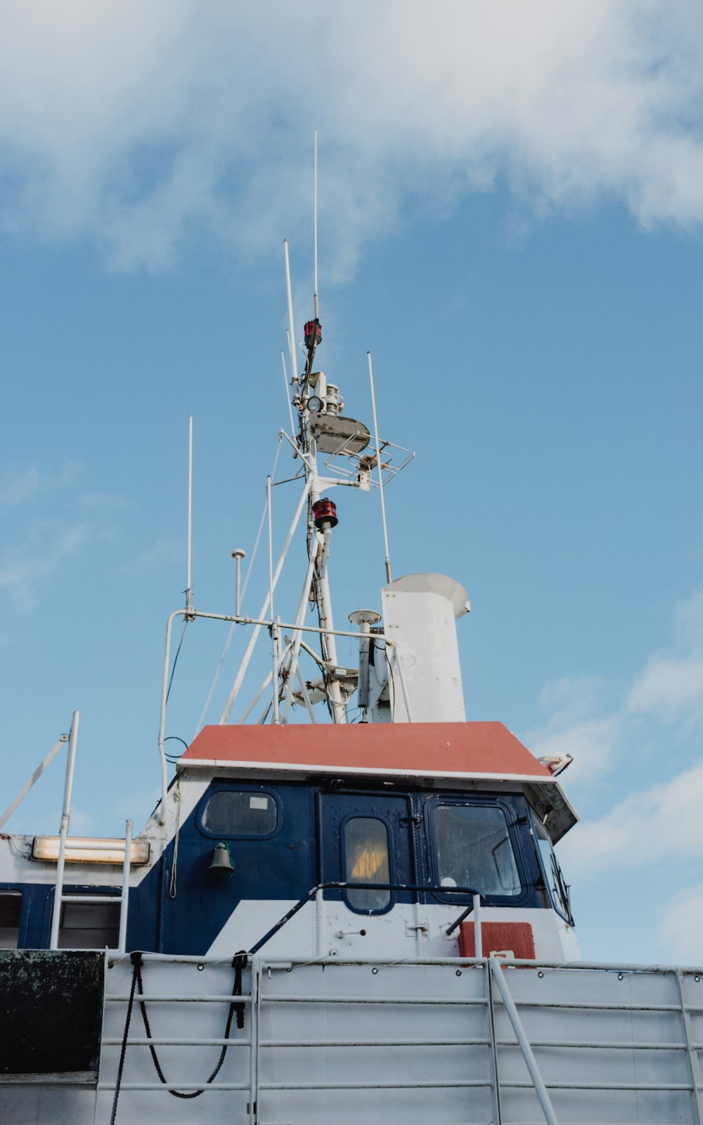 orange and white ship on sea during daytime