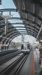 people walking on train station during daytime