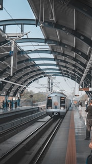 people walking on train station during daytime