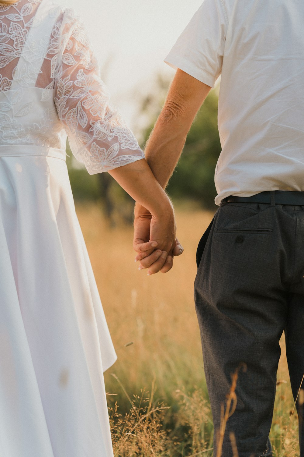 man and woman holding hands