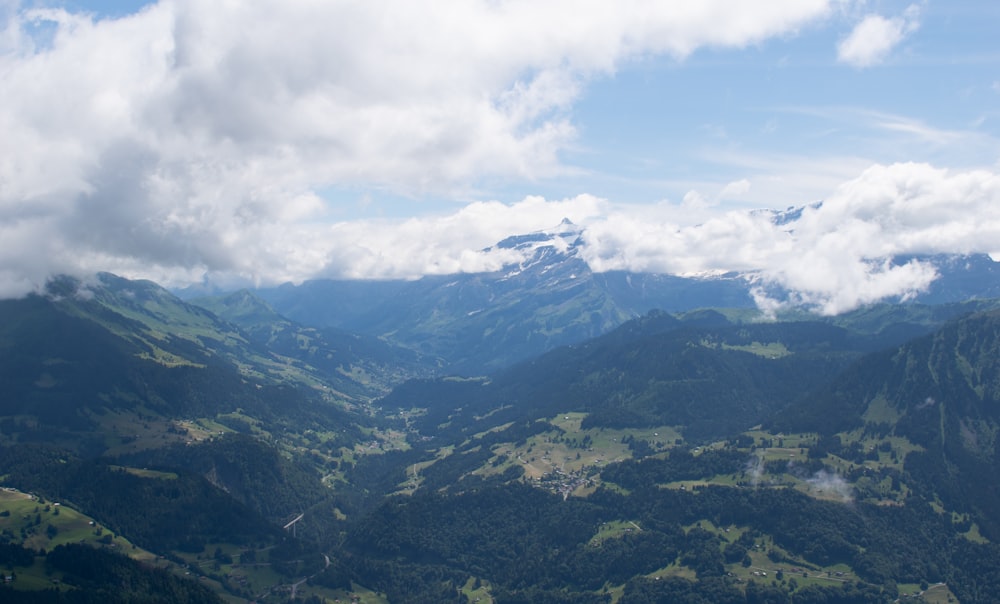 green mountains under white clouds during daytime