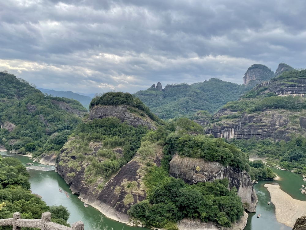 green and brown mountain under white clouds during daytime