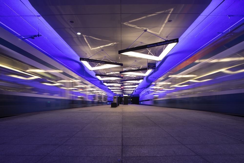 white and purple train in tunnel