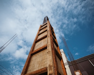 brown concrete building under blue sky during daytime