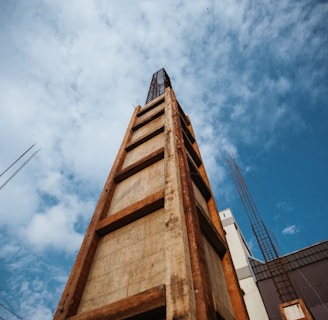 brown concrete building under blue sky during daytime