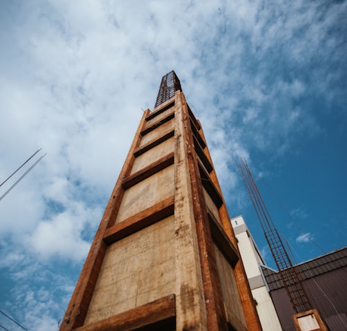 brown concrete building under blue sky during daytime