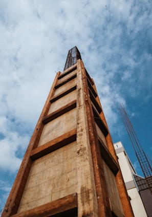 brown concrete building under blue sky during daytime