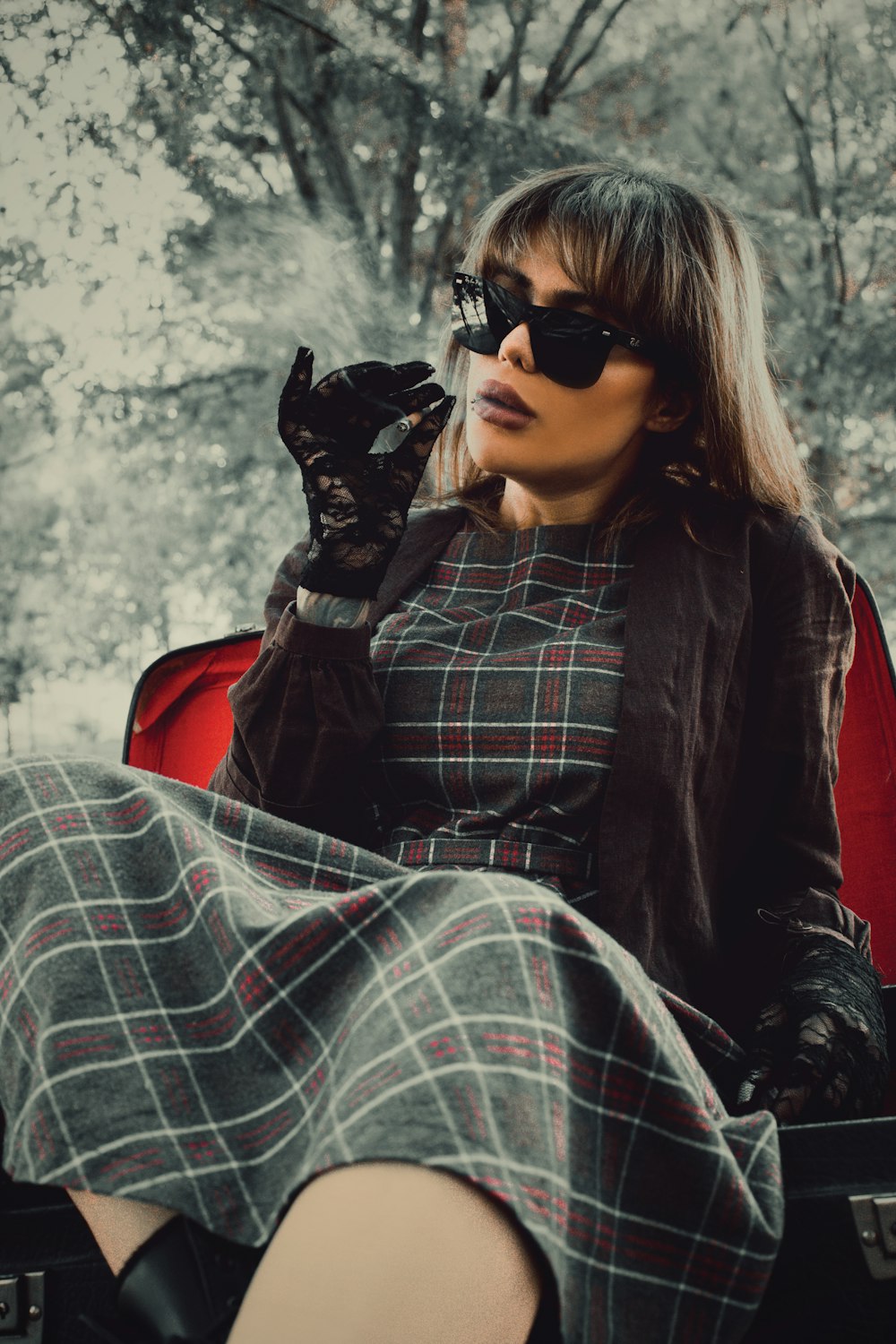 woman in black leather jacket and black sunglasses