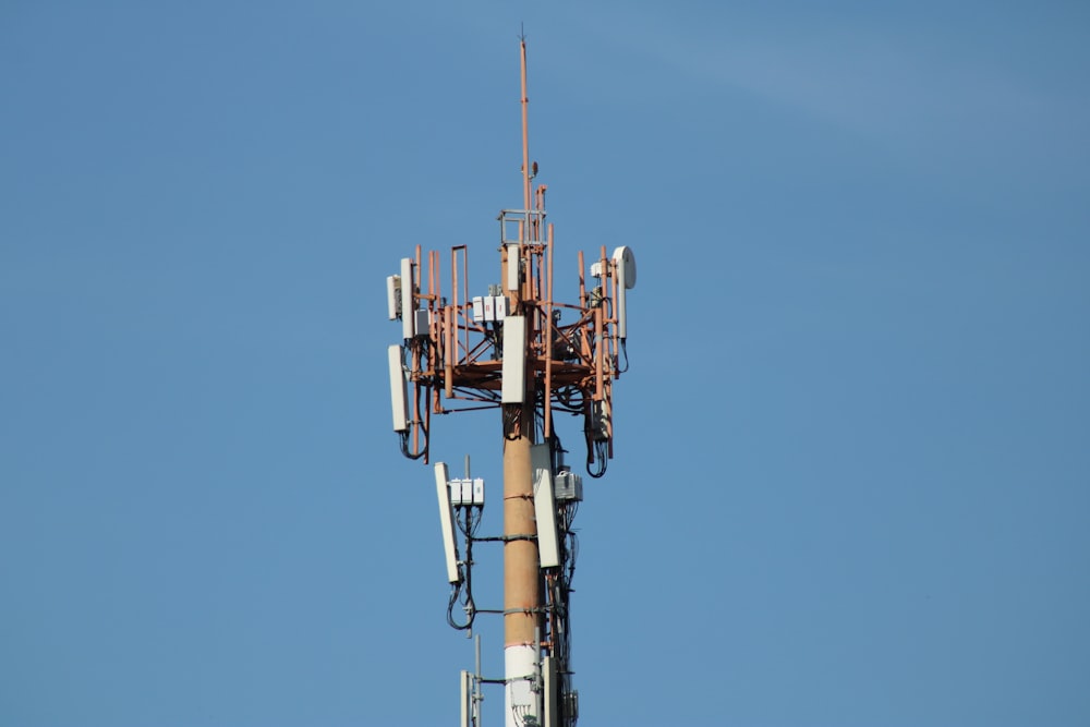 brown and white metal tower under blue sky during daytime