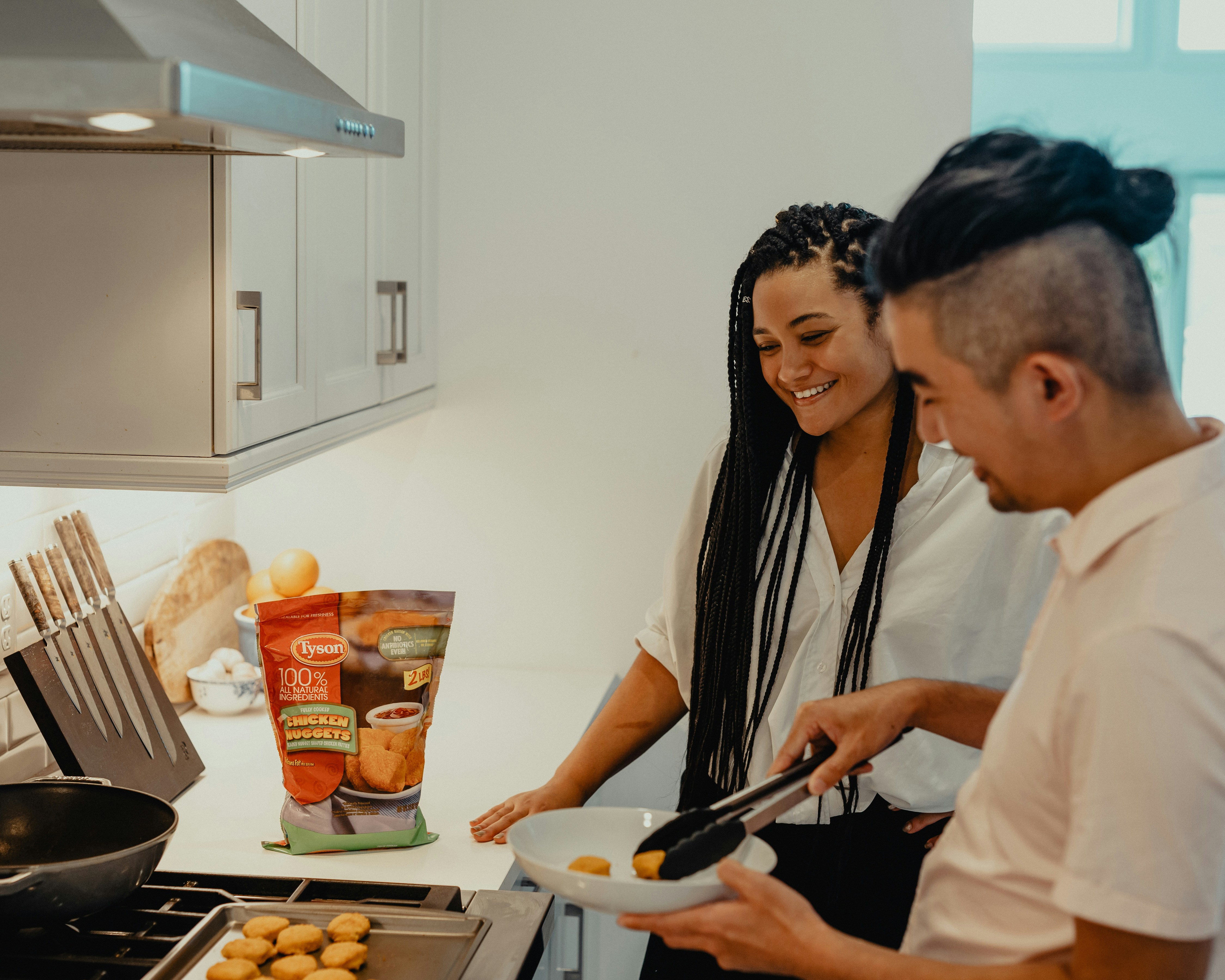 Family cooking together in kitchen