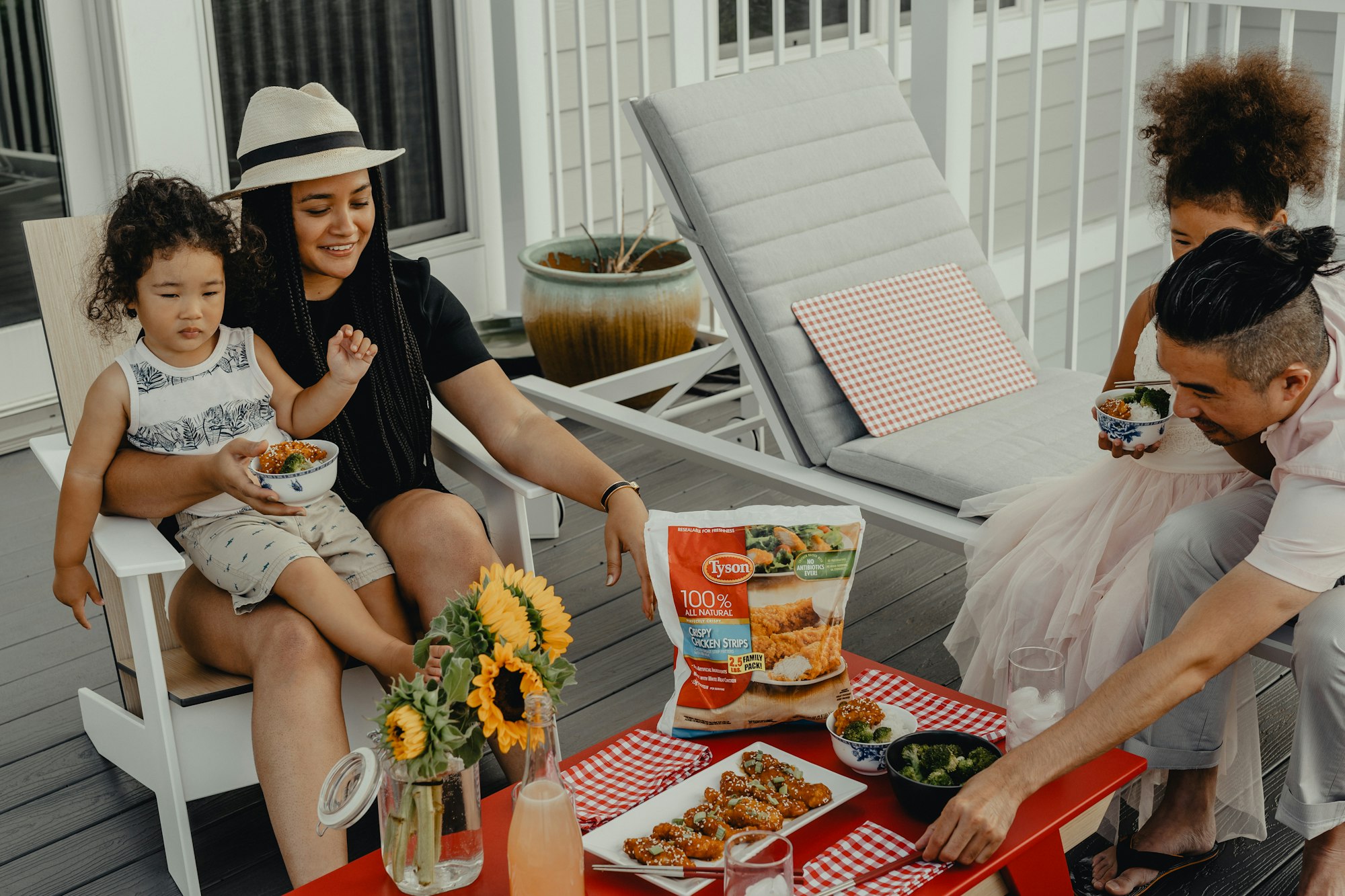 A family eating together by the front porch