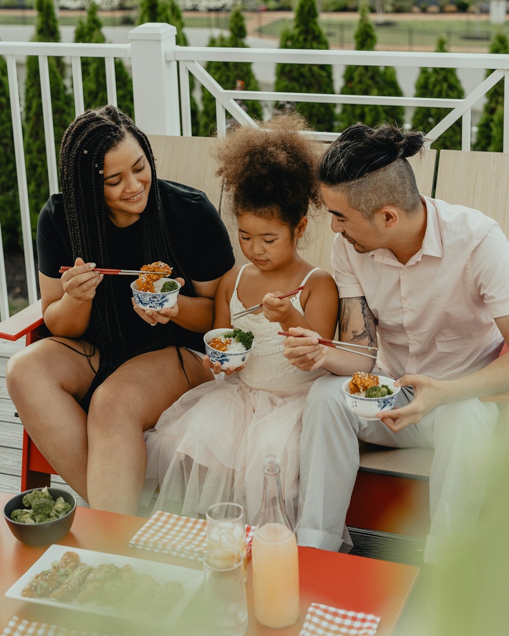 man and woman sitting on chair eating