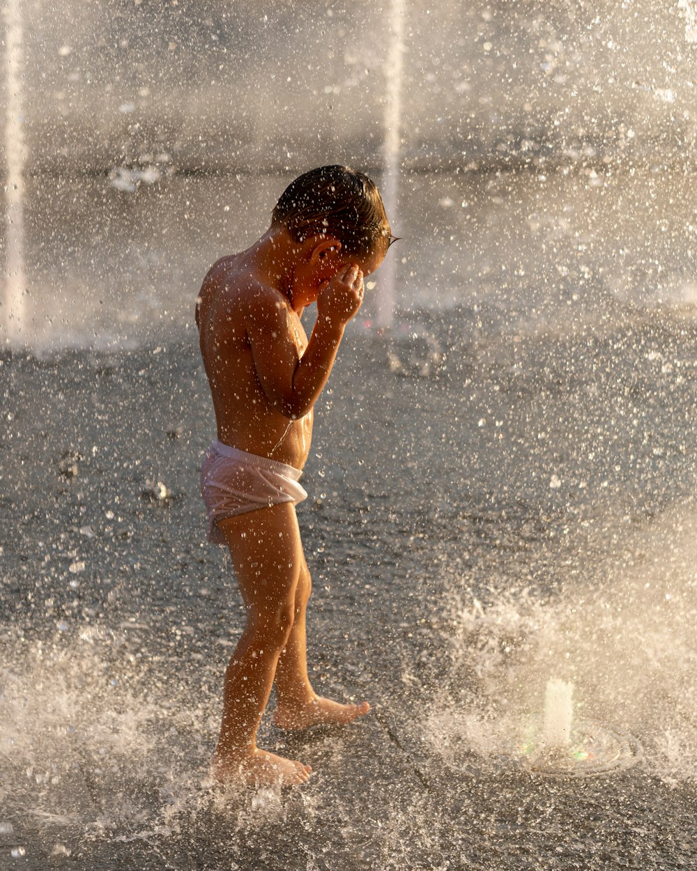 topless woman in white panty standing on water