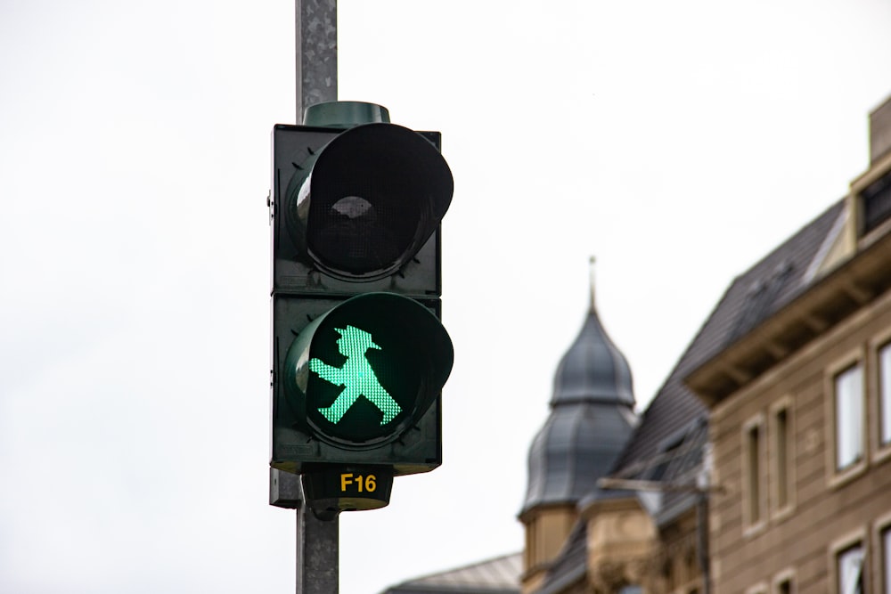 black traffic light with green light