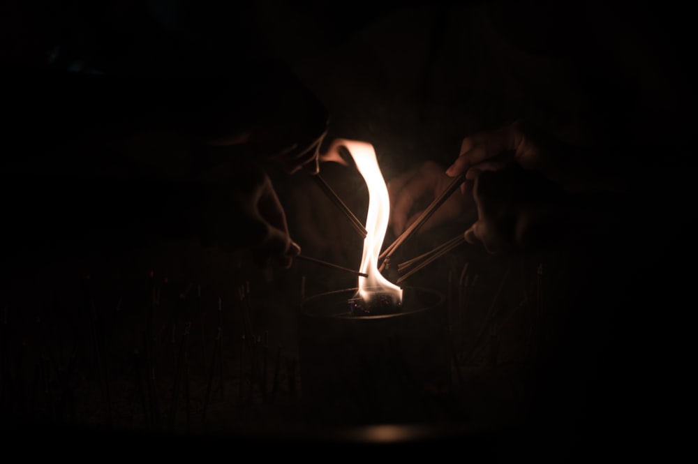 person holding fire during night time