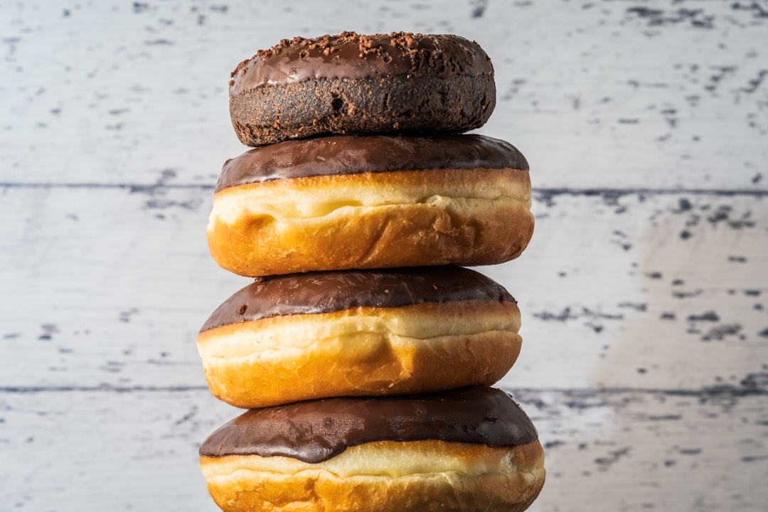 3 brown and black donuts