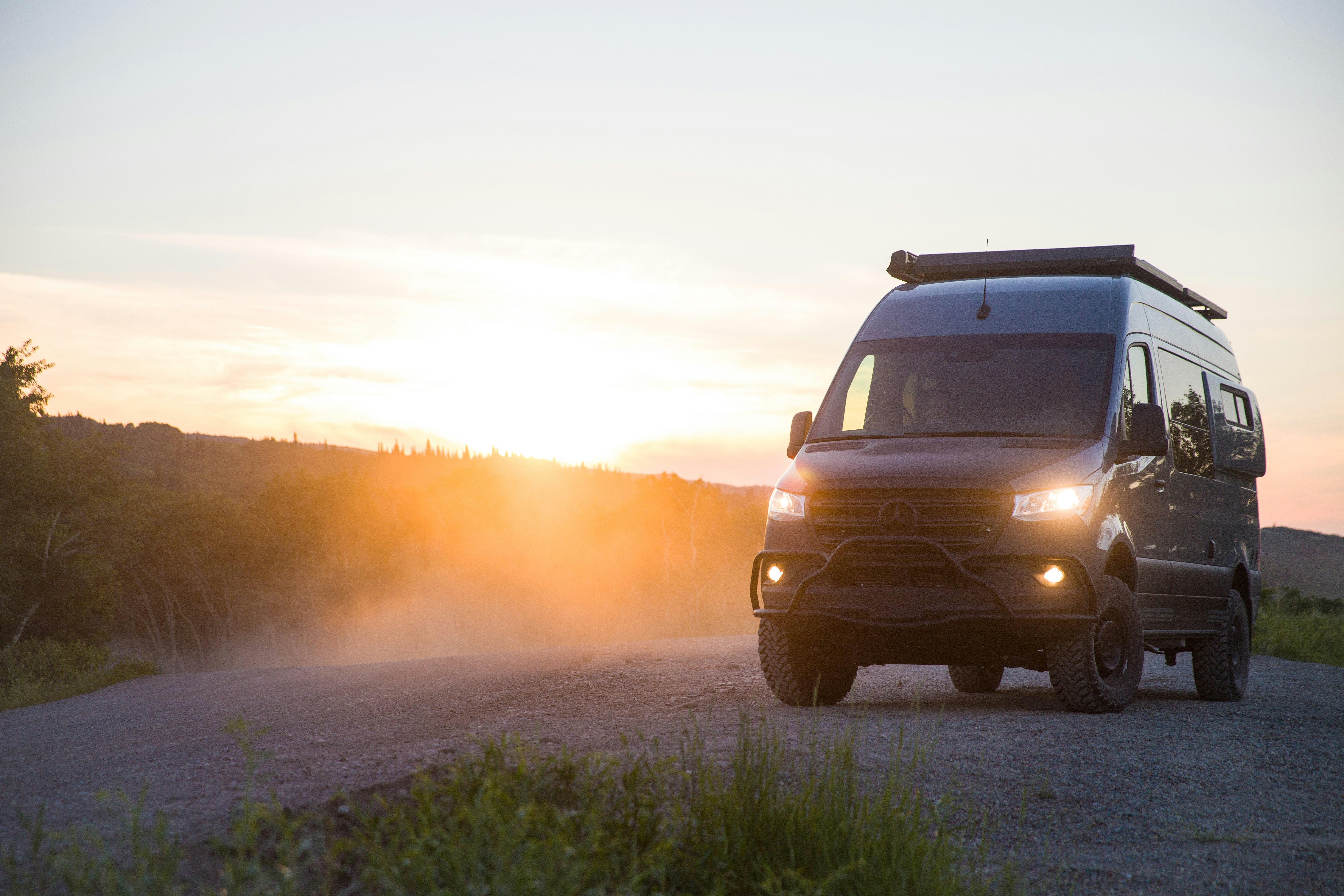 brown suv on dirt road during daytime