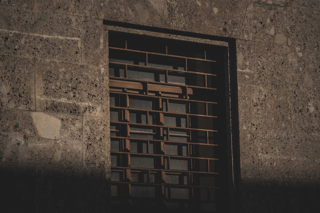 brown wooden window frame on gray concrete wall