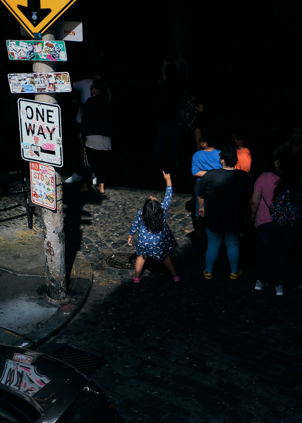 people standing on street during night time