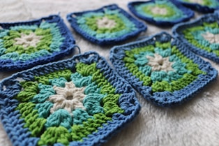 green white and yellow knit textile