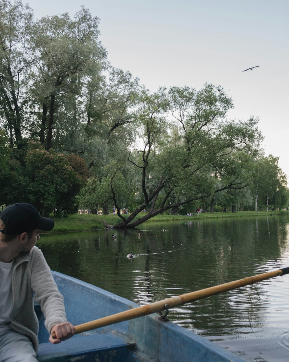 man in white shirt sitting on boat during daytime