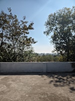 Wide shot of a completed concrete patio with clean edges and a textured surface.