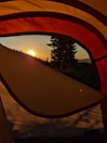 Sunrise view from the tent’s front porch overlooking misty mountain peaks.