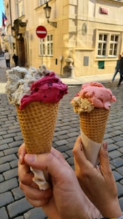 A candid shot of a family sharing ice cream cones on a bustling city street during a sunny afternoon.