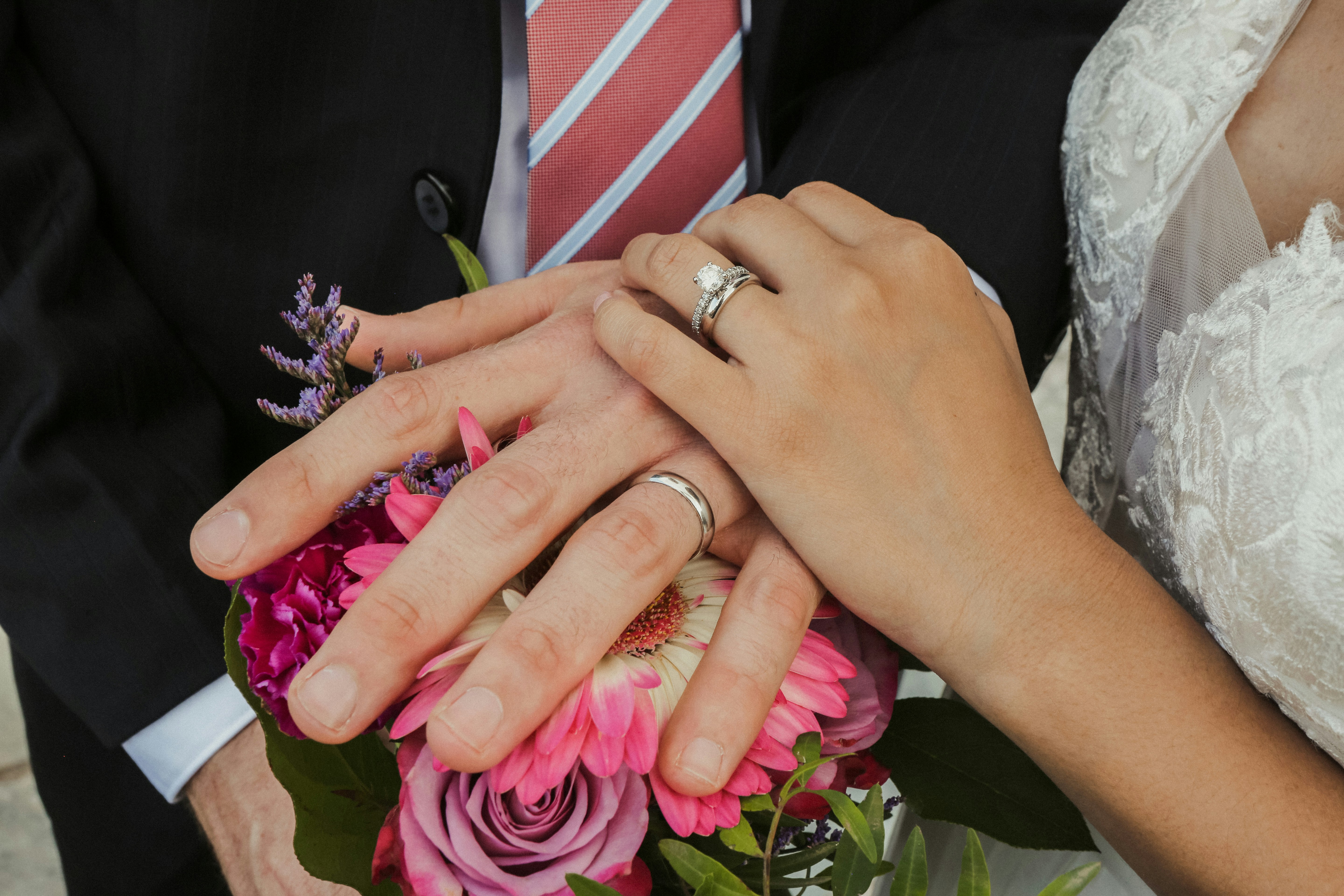 person wearing silver diamond ring