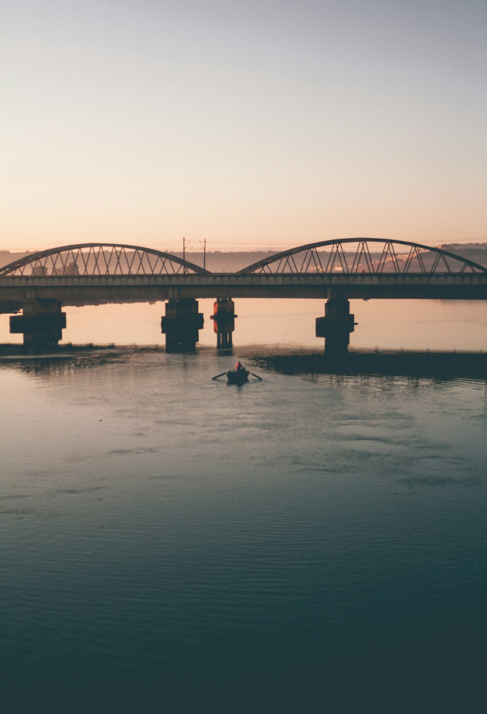 people walking on bridge during daytime