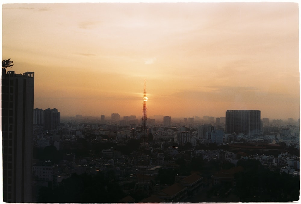 city skyline during sunset with orange sky