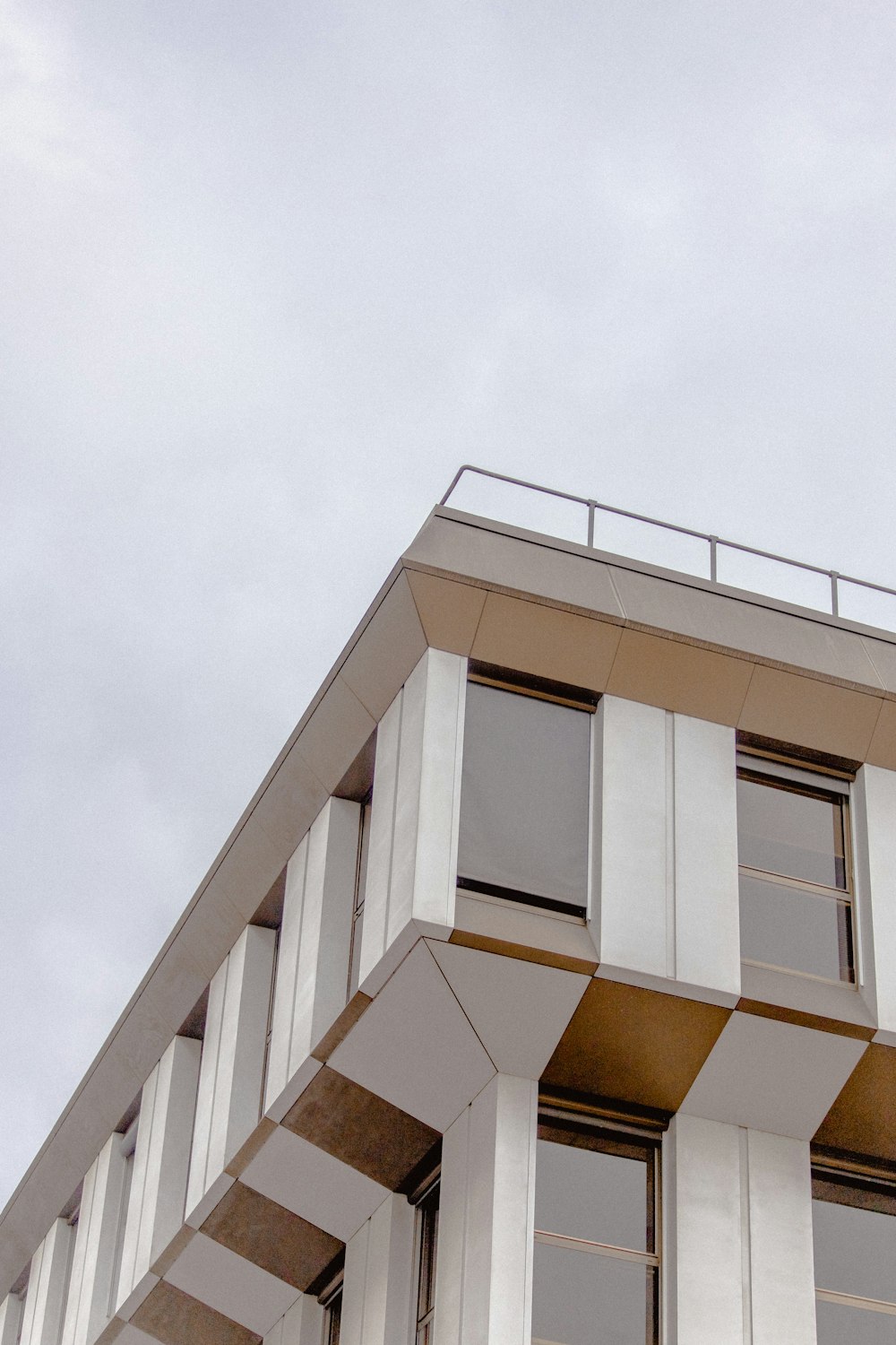 white concrete building under white sky during daytime