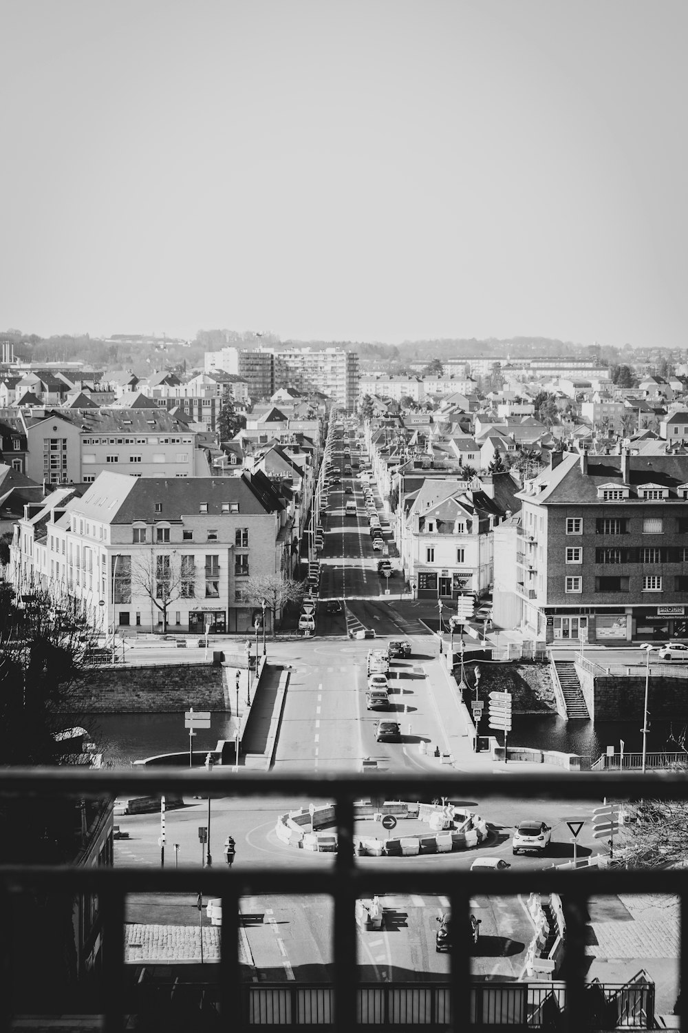 grayscale photo of city buildings