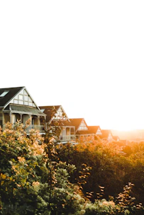 A row of neat, affordable park homes set against the rolling hills of Limpopo at sunset.