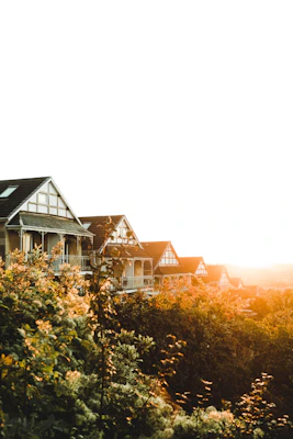 A row of neat, affordable park homes set against the rolling hills of Limpopo at sunset.