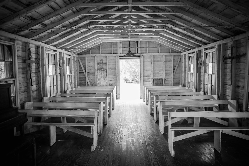 grayscale photo of wooden bench