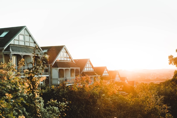A rustic postcard featuring Rouen's half-timbered houses bathed in warm sunlight.