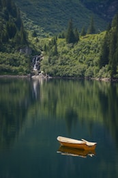 brown boat on lake during daytime