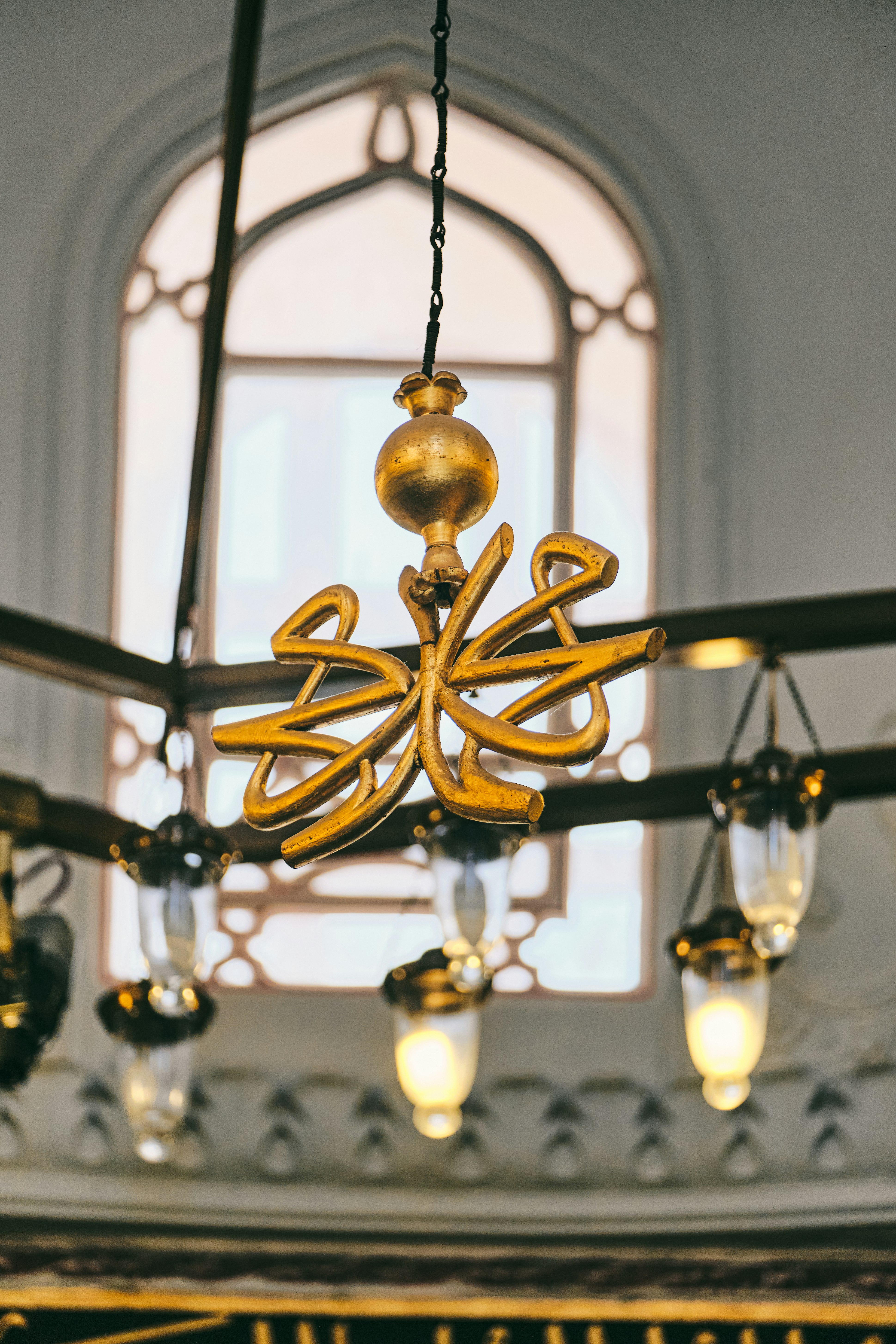 gold and white pendant lamp