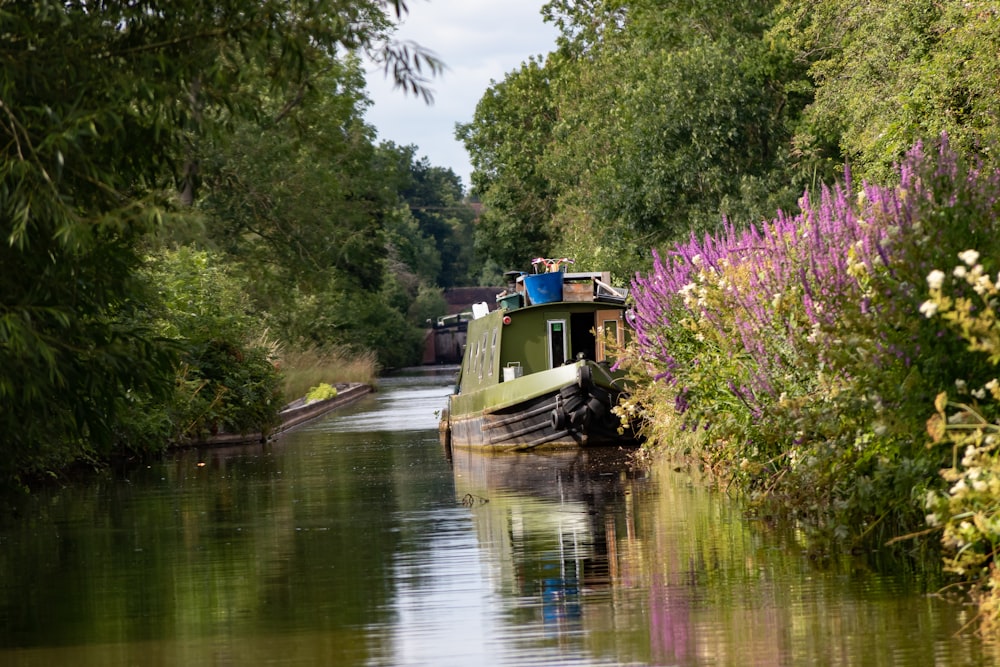 white and blue boat on river during daytime